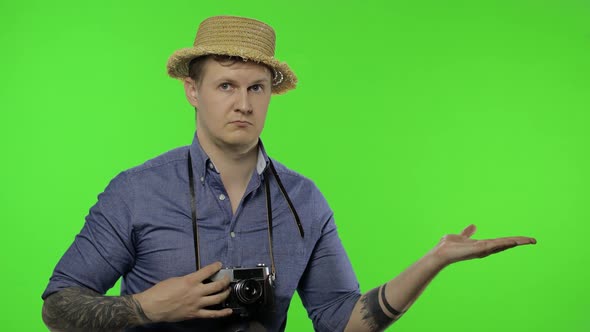 Portrait of Young Man Tourist Photographer Pointing at Something, Chroma Key alt