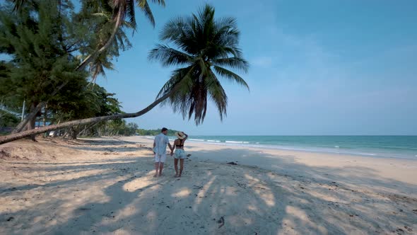 Couple on Vacation in Thailand Chumpon Province White Tropical Beach with Palm Trees Wua Laen Beach alt