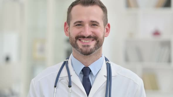 Portrait of Male Doctor Smiling at the Camera alt
