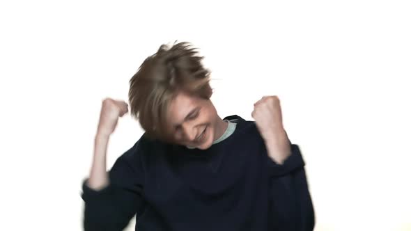 Portrait of Teenage Boy in Braces Being Excited Ecstatic Expressing Delight Behaving Like Winner alt