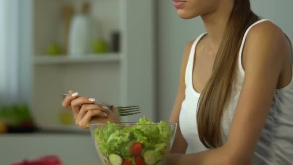 Fit Girl Eating Salad Instead of Pie, Low-Carb Diet, Vitamins, Healthy Lifestyle alt