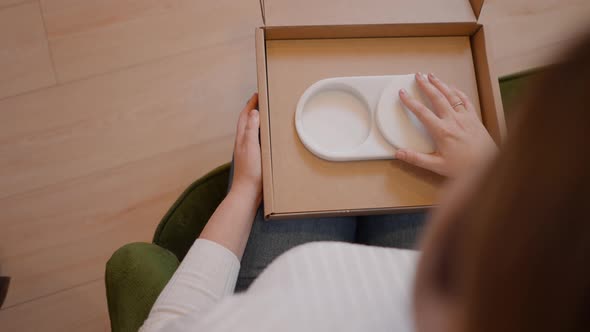 Woman Product Designer Checking If the Cap of Jewellery Box Slides Well Before Packaging Product in alt