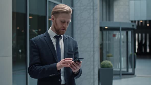 Handsome Bearded Startup Businessman Using Mobile Phone