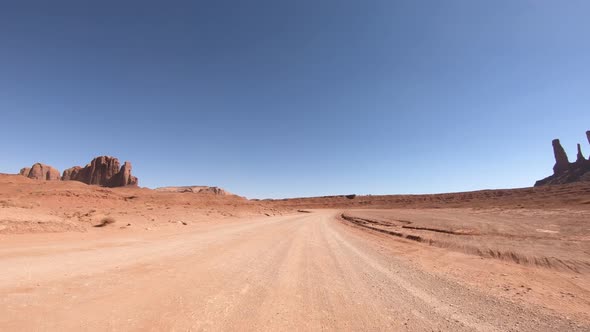 Crossing Mounument Valley in Summer Season View From the Front of the Car alt