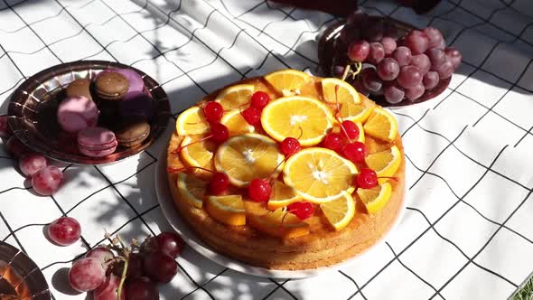 pie with oranges for a event day on picnic checked cloth alt