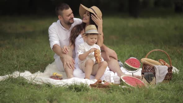 Loving Married Couple and Their Son Spending Their Weekend Outdoors