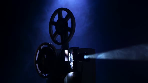 Projection Rays. Film Projector Turns Film in Smoky Dark Studio, Stock ...