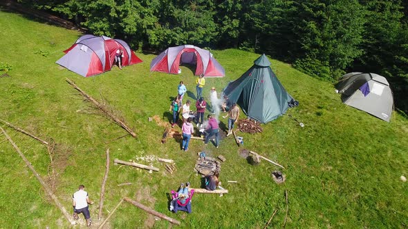 Aerial shot mountain forest with camp