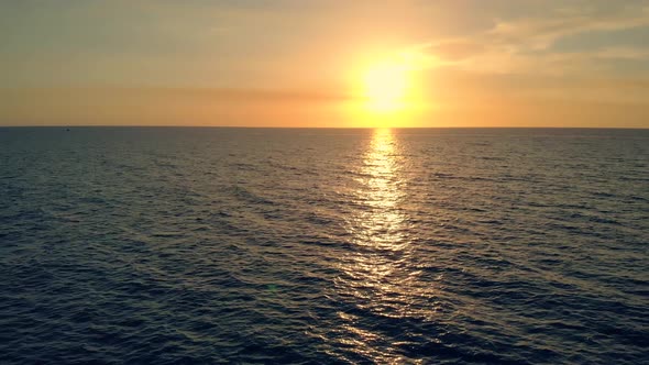 Golden Sun Reflected on Ocean Surface at Sunset