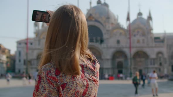 Woman Takes Selfie By Phone in Venice on Piazza San Marco in Italy Europe