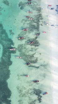 Vertical Video Boats in the Ocean Near the Coast of Zanzibar Tanzania alt