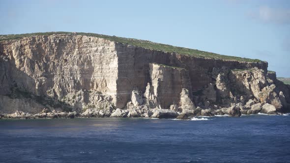 Steep Limestone Island Shore in Mediterranean Sea near Malta