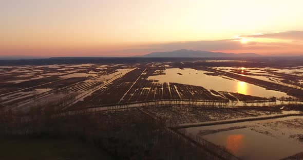 Aerial, Beautiful Fall Landscape On A Big Pond  On Sunset With Low Water And Sun Reflections 