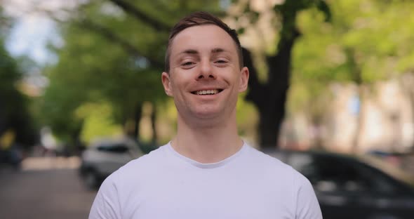 Slow Motion Portrait of Happy Caucasian Man Smiling alt