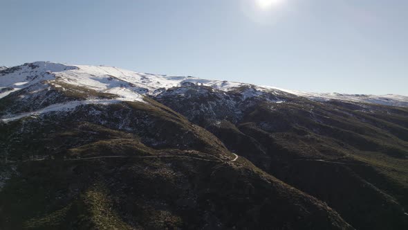 Snowy peak of mountain range, Sierra Nevada in Spain. Aerial drone view