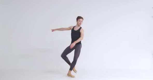 Young Male Ballet Dancer Performs Pirouette and Acrobatic Elements in Ballet Dance White Background alt