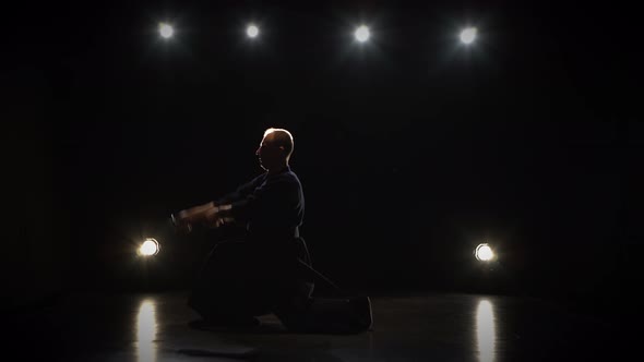 Kendo Fighter Practicing Martial Art with the Katana Sword alt