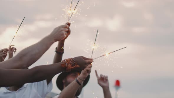 People with Sparklers Partying Outdoors alt