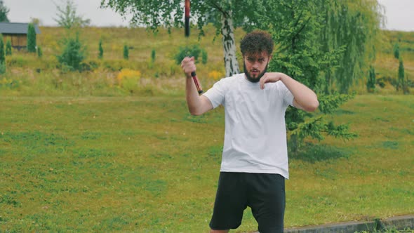 Man Twists Nunchucks alt