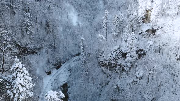 Beautiful Snowy Landscape with Railway in the Gorge