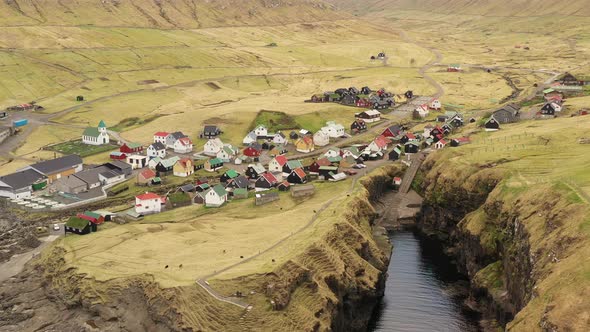 Drone Over Village By Sorvagsvatn Or Leitisvatn Lake alt