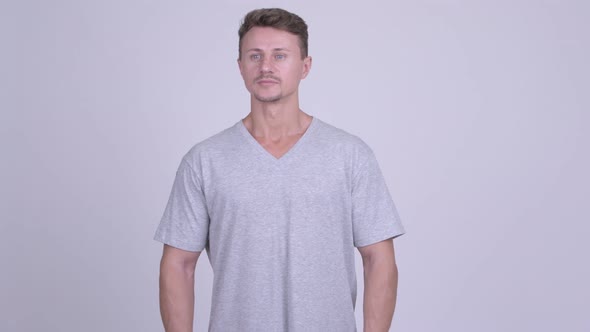 Happy Bearded Man Smiling and Waving Hand alt