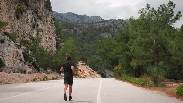 Triathlete training outdoors. Triathlon run exercises. alt