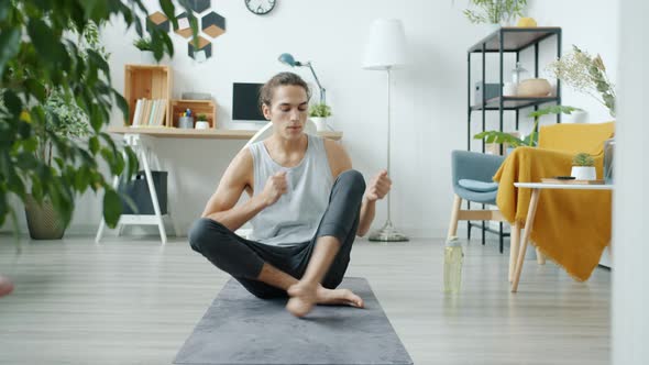 Portrait of Sports Vlogger Recording Yoga Tutorial Speaking and Exercising Looking at Camera in alt