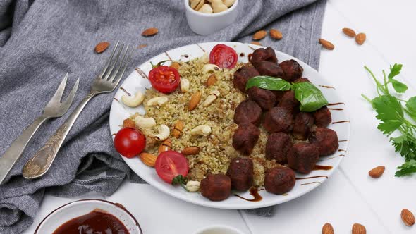 Bulgur with Vegetables on Plate on White Background alt