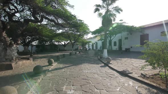 Push in shot lens flaring of colonial park in giron santander alt