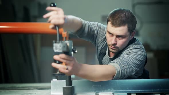 Carpenter Working in Studio alt