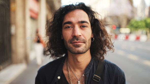 Young attractive italian guy looks into the camera and smiles at old ...