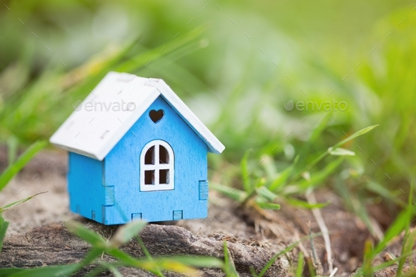 Wooden house model close up. Real estate business. Cottage for sale. Selling and buying home.  - Stock Photo - Images