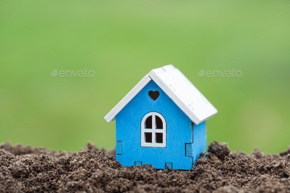 Wooden house model on plot of land close up. Real estate business. Cottage for sale. Selling - Stock Photo - Images