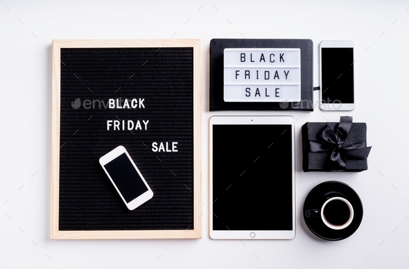 Black friday, seasonal sale concept. Text black friday sale on black letter board with cup of coffee