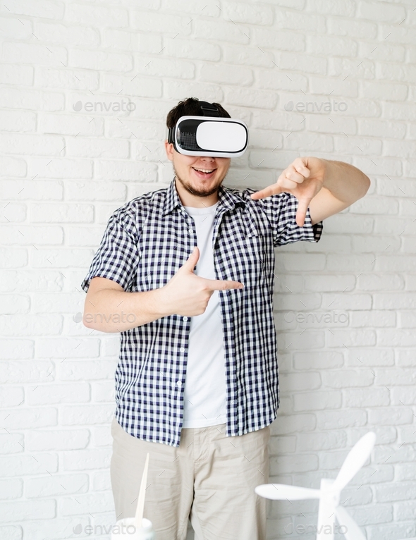 Man using VR glasses, visualising environmental project