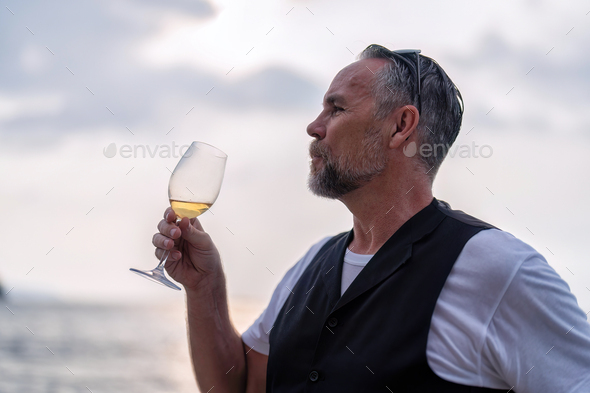 business man traveling on holiday stand in the yacht deck freedom drinking relaxation