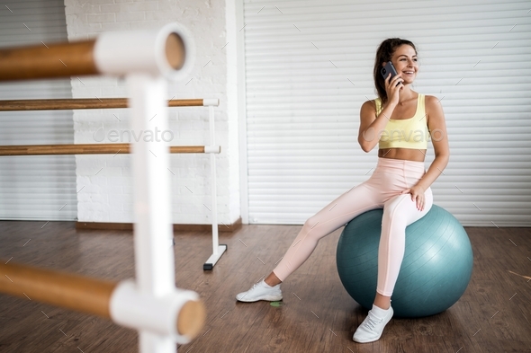 fitness ball sportive woman working out in the gym, cardio exercise burning calories