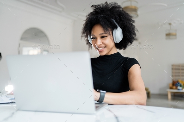woman economist manager millennial works in office uses laptop report in company