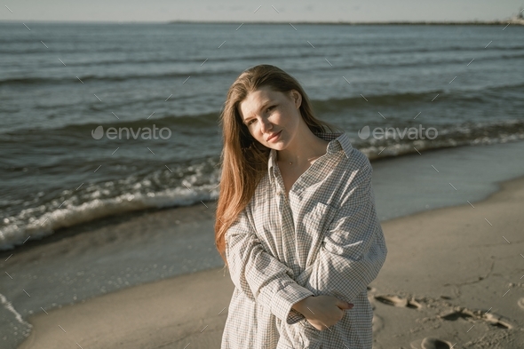 portrait of a girl with long red hair on the seashore Stock Photo by ...