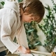 Cute boy painting at home, using online lesson on smartphone. Online education concept - PhotoDune Item for Sale