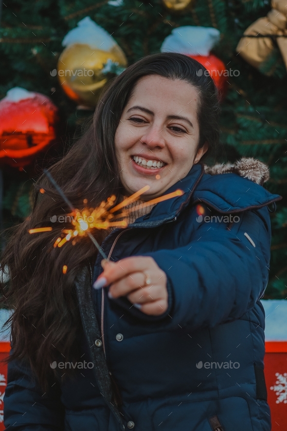 Happy girl with sparkles in Christmas - Stock Photo - Images