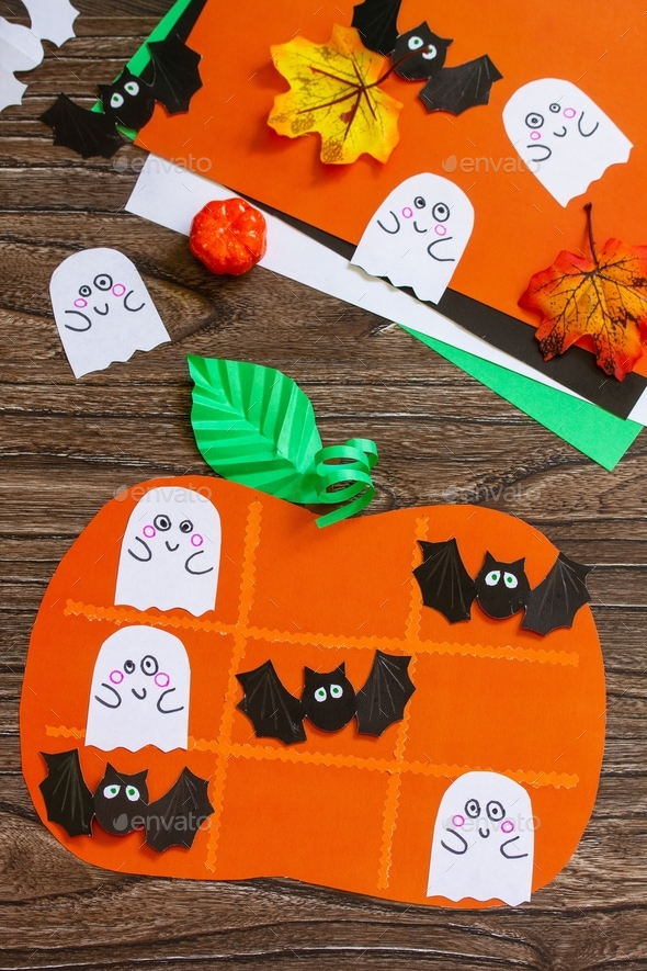 Funny paper toy in the form of a Halloween pumpkin, fun activities for kids.