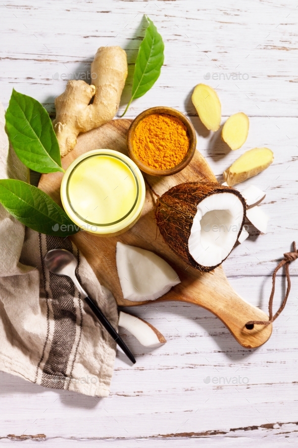 Cup of Healthy ayurvedic drink golden coconut milk turmeric iced latte