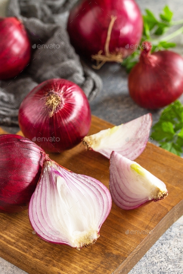 Purple Onions. Fresh whole purple onions and one sliced onion on a