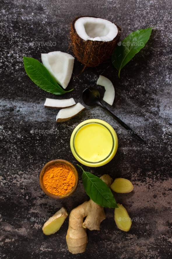 Healthy drink. Ayurvedic golden coconut milk with curcuma powder ginger