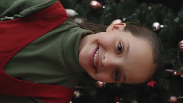 Portrait of Pretty Little Girl at Christmas Tree alt