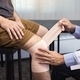 Asian physiotherapists are examining the results of knee surgery. - PhotoDune Item for Sale