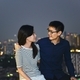 Asian Couple looking each other on rooftop with city background, Bangkok, Thailand - PhotoDune Item for Sale