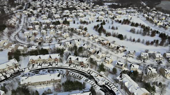 Aerial View Over Private Houses in Wintertime of Snow Covered Traditional Housing Suburbs alt